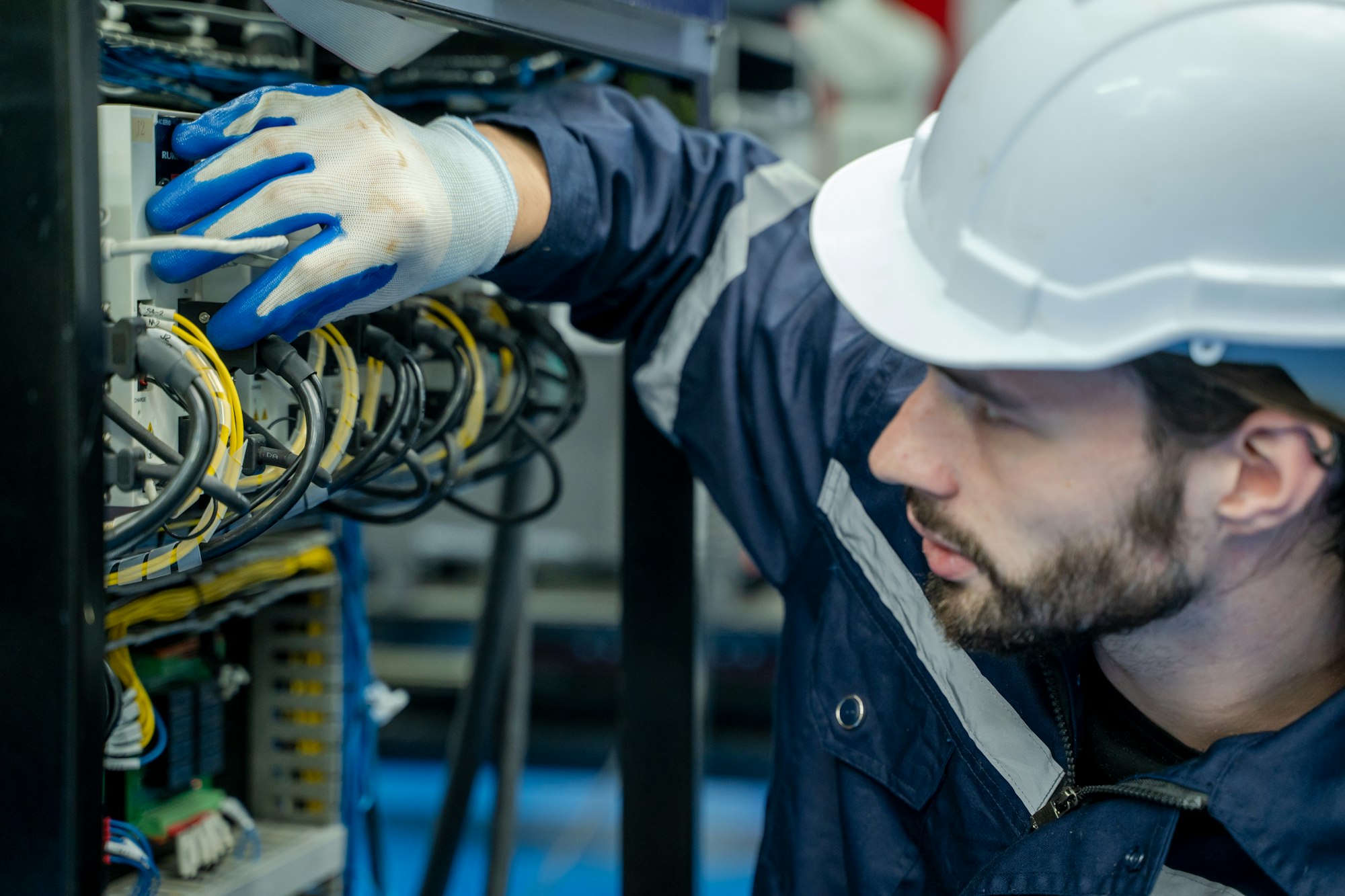 Electrical engineers test electrical installations and wiring on protective relays.